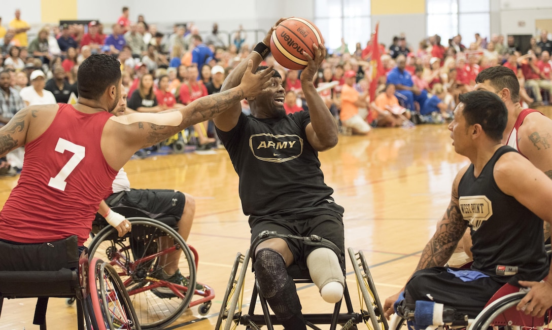 From left, Marine Corps veteran Jorge Salazar, Army veteran Alexander Shaw, Army veteran Jhoonar Barrera and Marine Corps Sgt. Zackariah Guess battle for the ball as the Army team defeats the Marines to win the gold medal in wheelchair basketball during the 2016 Department of Defense Warrior Games at the U.S. Military Academy in West Point, N.Y., June 21, 2016. DoD photo by Roger Wollenberg