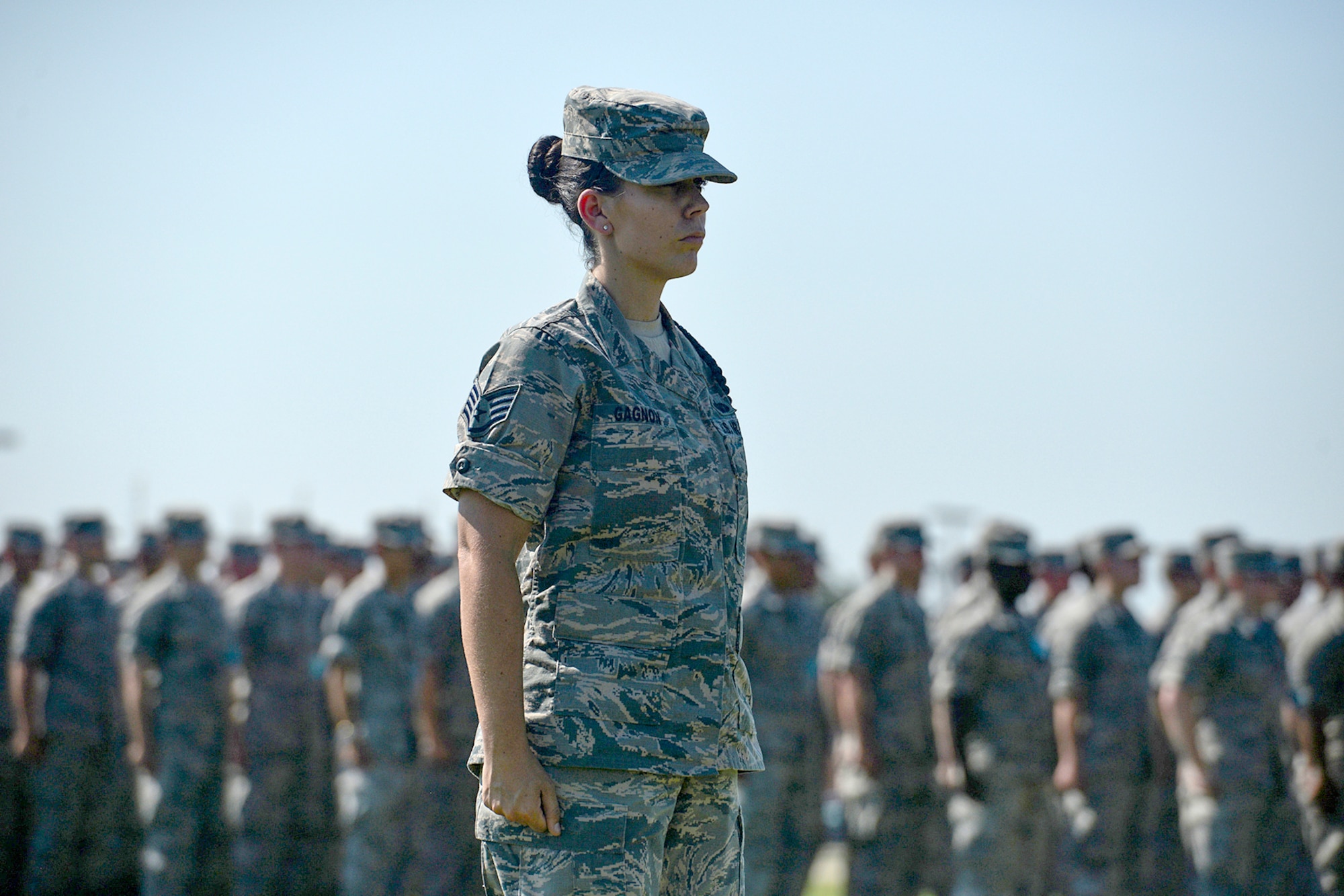 U.S. Air Force Staff Sgt. Amber Gagnon, 316th Training Squadron Military Training Leader, leads students during retreat at the parade field on Goodfellow Air Force Base, Texas, June 17, 2016. Retreat marks the end of the duty day on military bases. (U.S. Air Force photo by Airman 1st Class Randall Moose/Released)