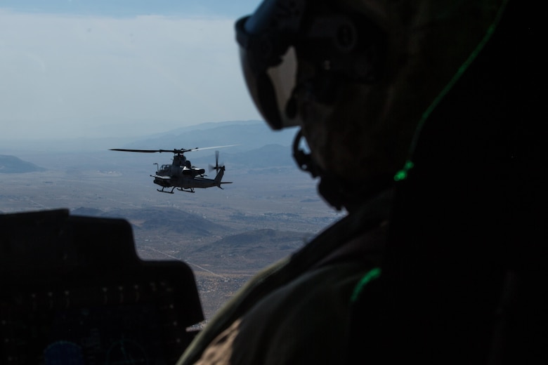 An AH-1Z Viper with Marine Light Attack Helicopter Squadron (HMLA) 267 “Stingers” flies as lead aircraft in a section flight to Marine Corps Air Ground Combat Center Twentynine Palms, Calif., June 10. Marines with HMLA-267 supported Marines with 3rd Battalion, 7th Marine Regiment, during a close-air-support training mission aboard the combat center. (U.S. Marine Corps photo by Sgt. Lillian Stephens/Released) (U.S. Marine Corps photo by Sgt. Lillian Stephens/Released)