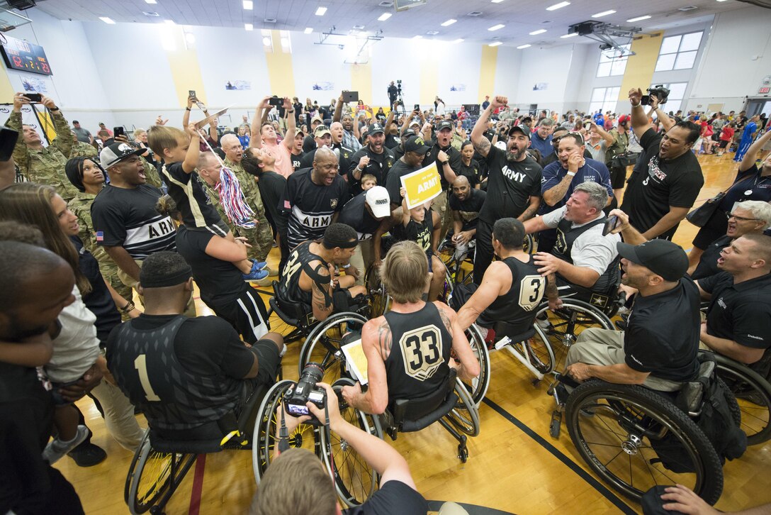 Army team members celebrate their gold medal win over the Marines in wheelchair basketball during the 2016 Department of Defense Warrior Games at the U.S. Military Academy in West Point, N.Y., June 21, 2016. DoD photo by Roger Wollenberg