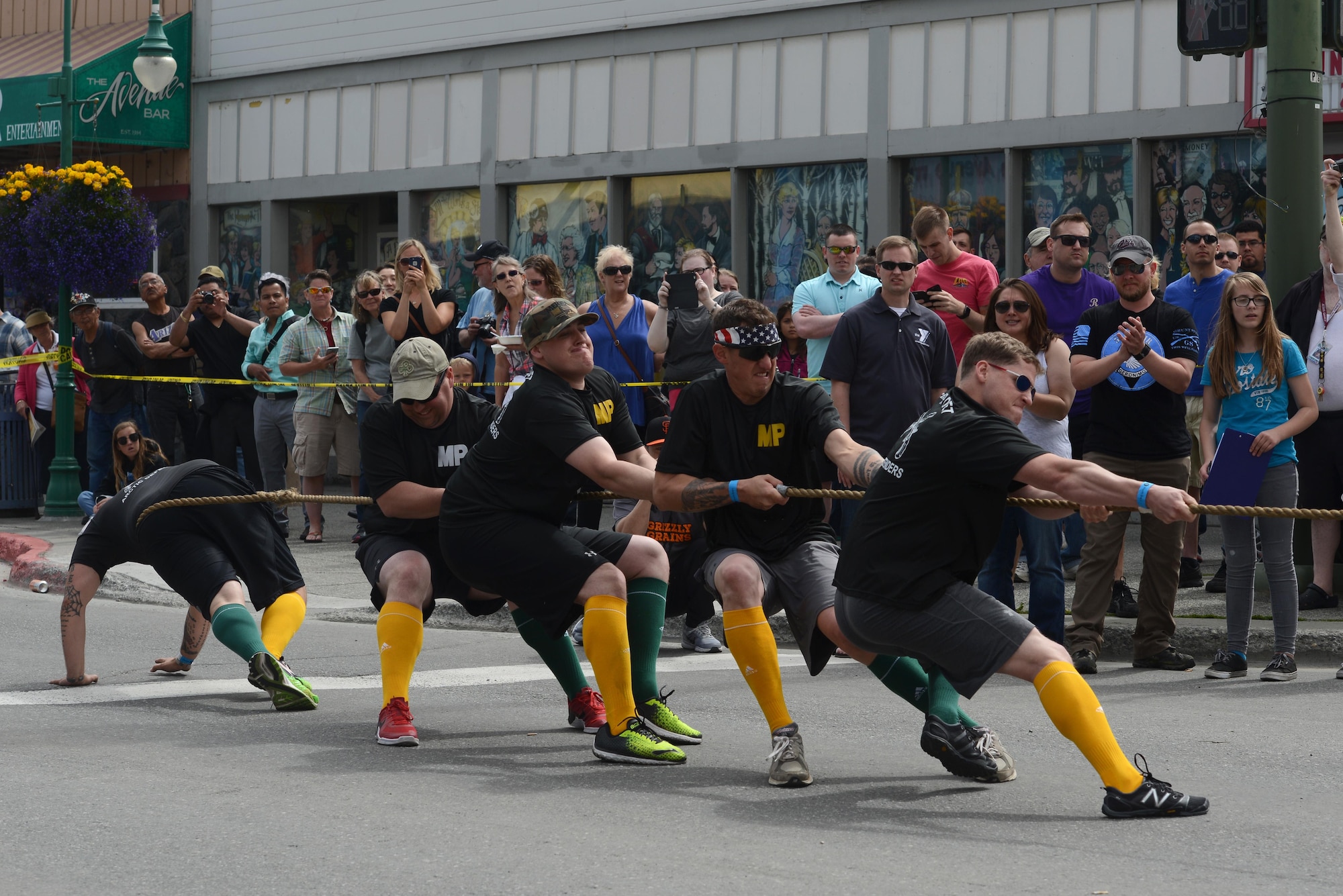 The ‘Arctic Defenders,’ of the 545th Military Police Company, competes in a tug-of-war challenge as part of the Hero Games during the Downtown Summer Solstice Festival in Anchorage, Alaska, June 18, 2016. Tug-of-war was the semi-final challenge to determine the final two teams. The Hero Games is a friendly competition between Alaska’s first responders with challenges that require balance, strength and teamwork. (U.S. Air Force photo Airman 1st Class Christopher R. Morales)