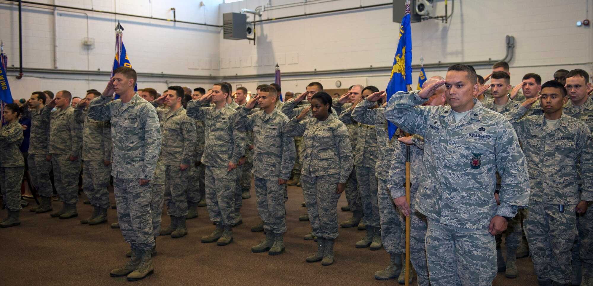 U.S. Air Force Airmen from the 23d Mission Support Group render salutes during a change of command ceremony, June 21, 2016, at Moody Air Force Base, Ga. The 23d MSG recognized the formal transfer of authority and responsibility for their unit as Col. Norman Dozier relinquished command to Col. Susan Riordan-Smith. (U.S. Air Force photo by Airman 1st Class Greg Nash/Released) 