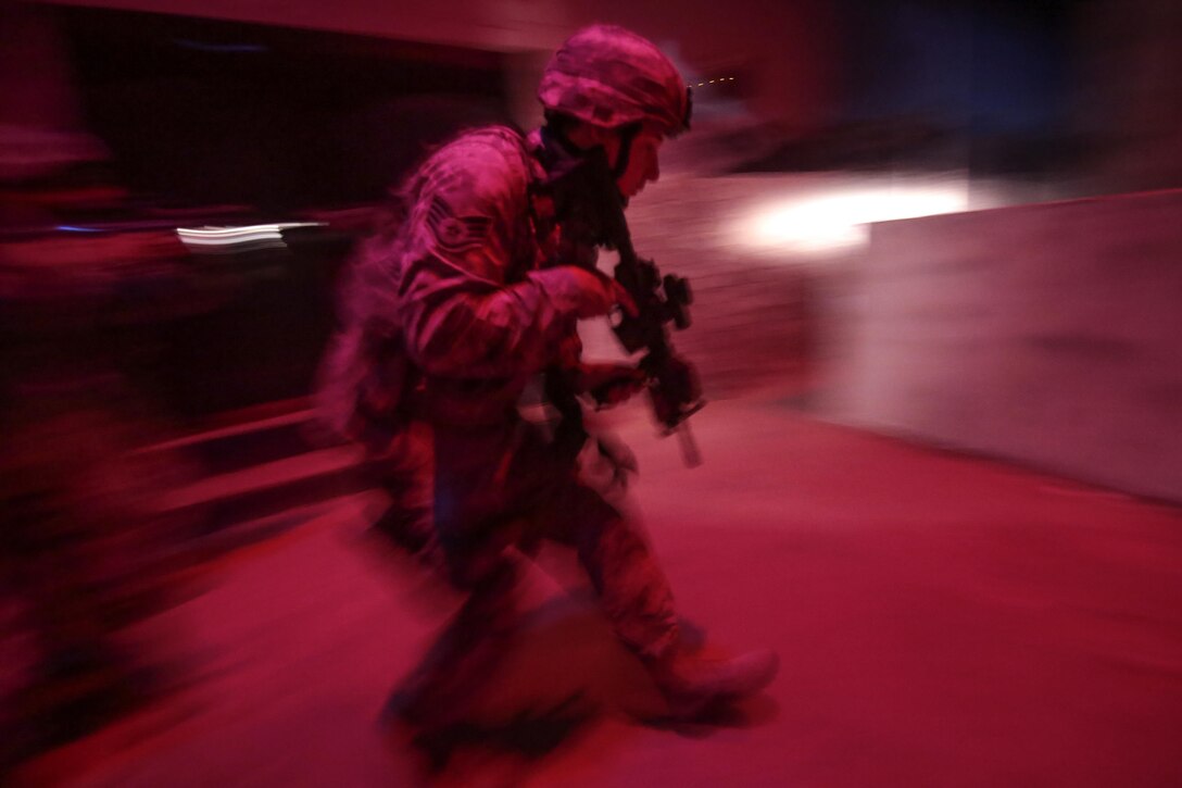 Air Force Staff Sgt. Christopher Raine maneuvers through an indoor site for military operations in urban terrain at Joint Base McGuire-Dix-Lakehurst, N.J., June 16, 2016. Raine is a security forces specialist assigned to the New Jersey Air National Guard's 177th Security Forces Squadron. Air National Guard photo by Tech. Sgt. Matt Hecht