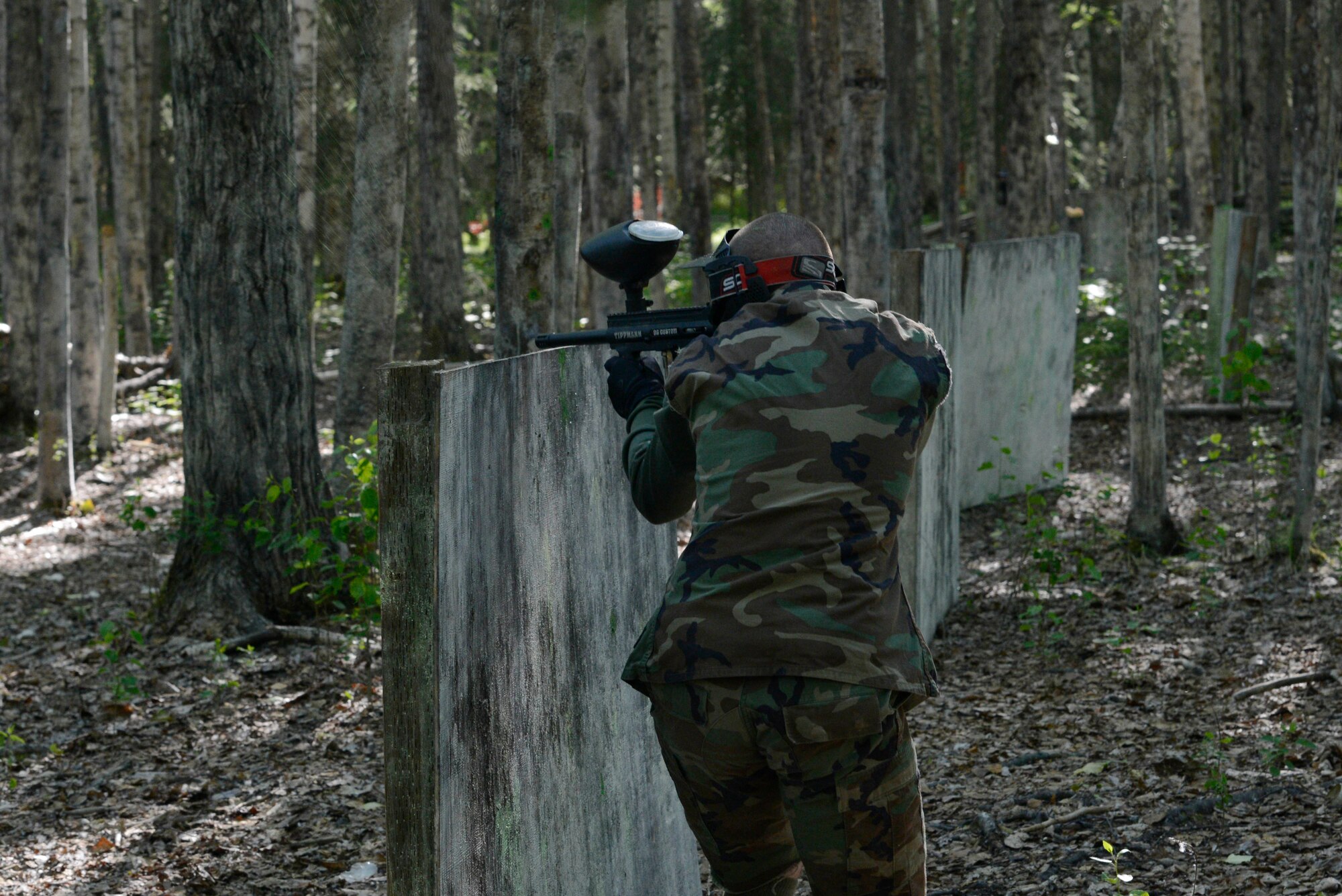 Airmen and Soldiers compete in a paintball tournament  during the 2016 Arctic Warrior Olympics at Joint Base Elmendorf-Richardson, Alaska, June 17, 2016. The Arctic Warrior Olympics originated in 1982, when Airmen at Elmendorf Air Force Base initiated Airman Day to promote camaraderie and good health. Then in 1986, it became known as Elmendorf Field Day. It was renamed the Arctic Warrior Olympics in 1989 and is hosted in conjunction with the Military Appreciation Picnics. (U.S. Air Force photo by Airman 1st Class Valerie Monroy)