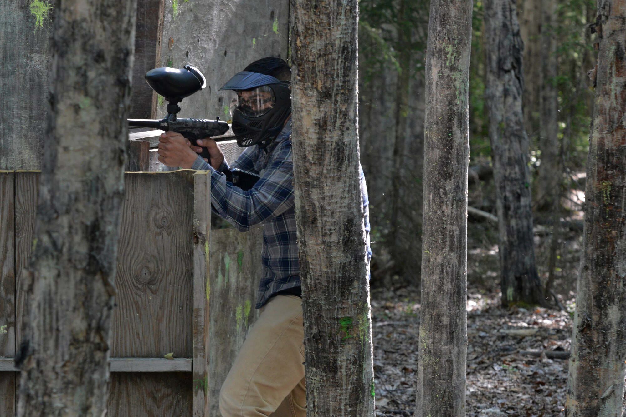 Airmen and Soldiers compete in a paintball tournament  during the 2016 Arctic Warrior Olympics at Joint Base Elmendorf-Richardson, Alaska, June 17, 2016. The Arctic Warrior Olympics originated in 1982, when Airmen at Elmendorf Air Force Base initiated Airman Day to promote camaraderie and good health. Then in 1986, it became known as Elmendorf Field Day. It was renamed the Arctic Warrior Olympics in 1989 and is hosted in conjunction with the Military Appreciation Picnics. (U.S. Air Force photo by Airman 1st Class Valerie Monroy)