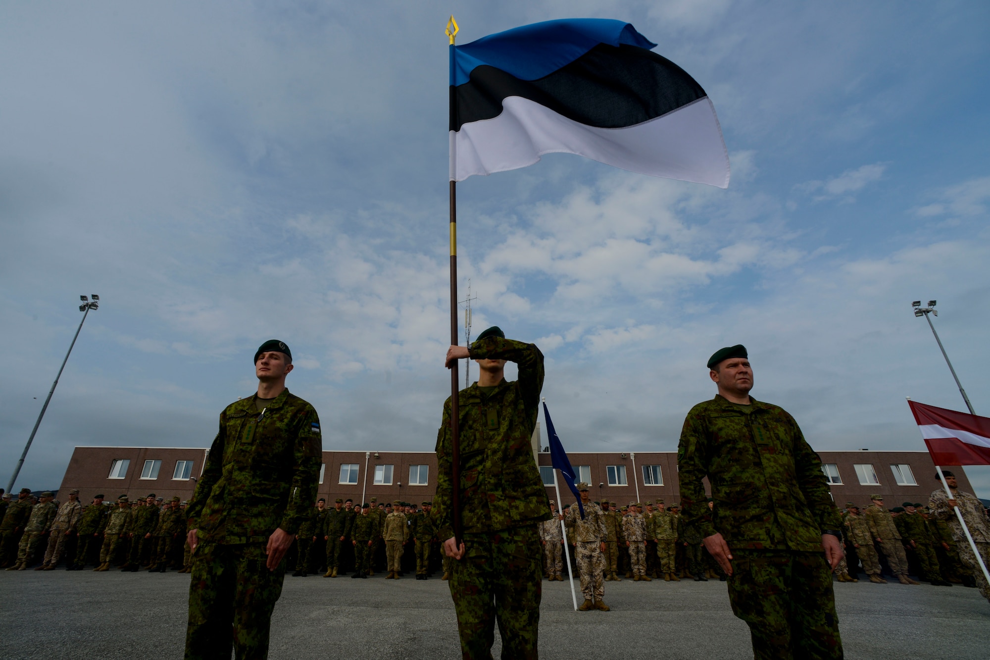 Estonian soldiers present the colors during the closing ceremony for Saber Strike 16 at Tapa Training Base, Estonia, June 21, 2016. U.S. forces in Europe participated in Saber Strike 16; a long-standing, U.S. Joint Chiefs of Staff-directed, U.S. Army Europe-led cooperative-training exercise, which has been conducted annually since 2010.  This year’s exercise focused on promoting interoperability with allies and regional partners. The United States has enduring interests in supporting peace and prosperity in Europe and bolstering the strength and vitality of NATO, which is critical to global security. (U.S. Air Force photo/Senior Airman Nicole Keim)