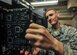 Airman 1st Class Patrick Nunn, an airfield systems technician with the 1st Special Operations Support Squadron, pulls a circuit board for inspection at Hurlburt Field, Fla., June 17, 2016. Airfield systems technicians install, remove and maintain navigation and air traffic control ground-to-air radio systems. (U.S. Air Force photo by Airman 1st Class Joseph Pick)