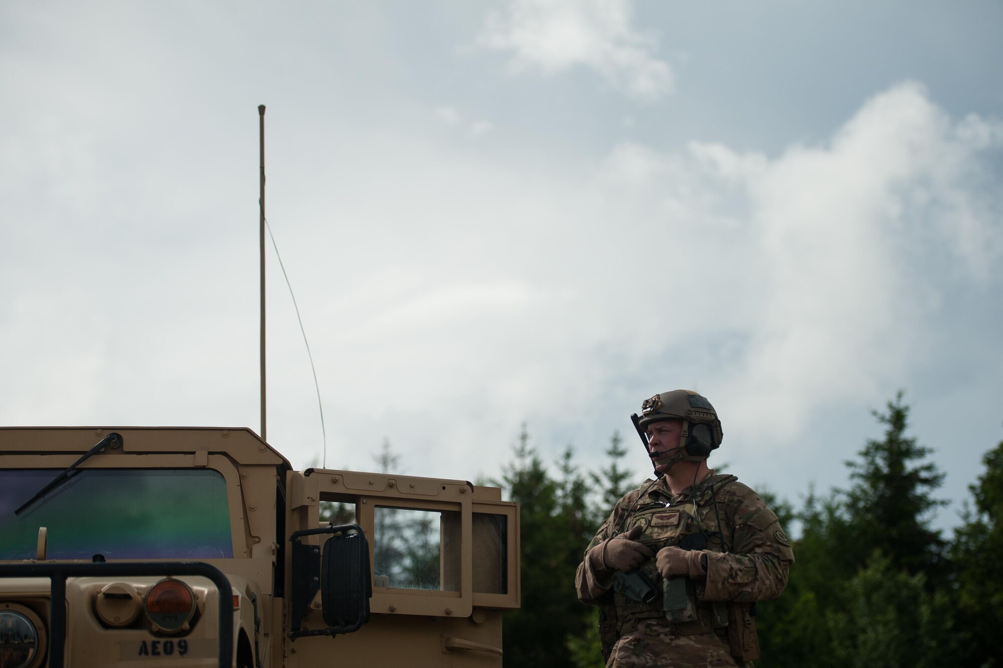 U.S. Air Force Maj. Aaron Cook, 621st Mobility Support Operations Squadron Air Mobility Liaison Officer to the 2nd Cavalry Regiment/Joint Multinational Training Center, advices an U.S. Air Force C-130J Super Hercules pilot during Exercise Swift Response 16 at Hohenfels Training Area, Germany, June 17, 2016. Exercise SR16 is one of the premier military crisis response training events for multinational airborne forces in the world, the exercise has more than 5,000 participants from 10 NATO nations. (U.S. Air Force photo by Master Sgt. Joseph Swafford/Released) 