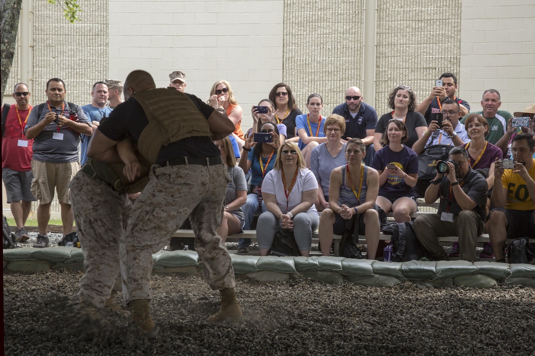 Marine Corps Martial Arts Program Instructors demonstrate different fighting techniques taught to Marines during the 2016 Key Leaders and Educators Workshop aboard Marine Corps Base Quantico, Va., June 22, 2016. Approximately 40 educators from states west of the Mississippi River are participating in different activities such as patrolling, flight simulations and many others during the week-long 2016 Key Leaders and Educators Workshop.