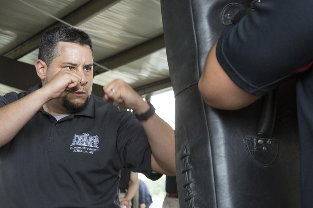 Pete Serrata executes Marine Corps Martial Arts strikes during the 2016 Key Leader and Educators Workshop aboard Marine Corps Base Quantico, Va., June 22, 2016. The workshop creates a mutually beneficial and meaningful relationship between educators and the Marine Corps where key leaders and educators can share knowledge about the Corps to students based on firsthand experience. Serrata is the Assistant Dean for Law Career Services at Oklahoma City University Law, Oklahoma City, Oklahoma.