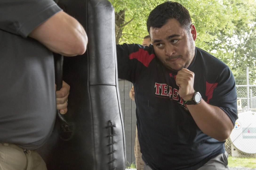 Gabriel Jimenez executes Marine Corps Martial Arts strikes during the 2016 Key Leader and Educators Workshop aboard Marine Corps Base Quantico, Va., June 22, 2016. The workshop includes events such as infantry patrolling, flight simulations and many others to provide educators a robust understanding of what goes into making Marine officers. Jimenez is an Assistant Director and Lead Counselor at Texas Tech University, Lubbock, Tx.