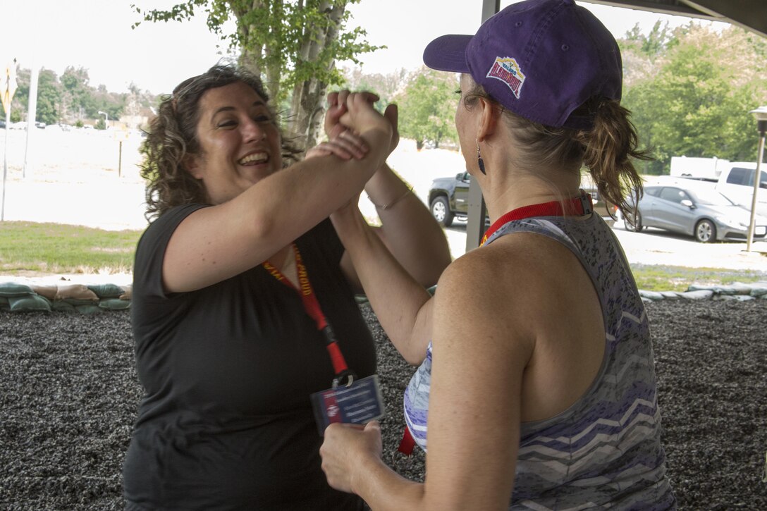 Erin McCormick executes Marine Corps Martial Arts joint manipulation techniques during the 2016 Key Leaders and Educators Workshop aboard Marine Corps Base Quantico, Va., June 22, 2016. The workshop helps Marines build
meaningful and purposeful relationships with those who have the privilege to guide America's leaders of tomorrow. McCormick is the Associate Director of Career Services at Montana State University, Bozeman, Montana
