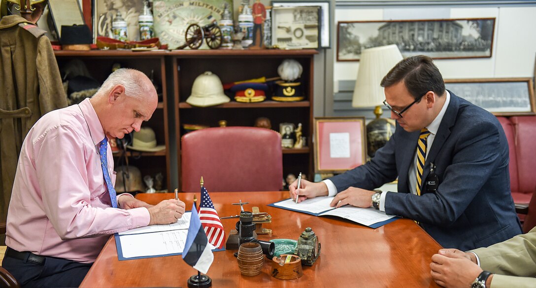 Jim Townsend, Deputy Assistant Secretary of Defense for Europe and NATO, left, and Eerik Marmei, Estonian ambassador to the United States, sign an agreement reinforcing cooperation between the U.S. Department of Defense and the Estonian Ministry of Defense on research, development, testing, and evaluation activities at the Pentagon, June 22, 2016. DoD photo by Sgt. 1st Class Clydell Kinchen