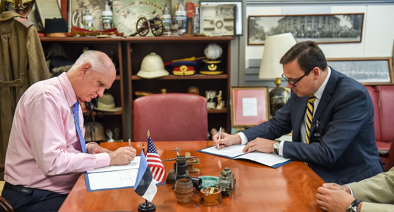 Jim Townsend, Deputy Assistant Secretary of Defense for Europe and NATO, left, and Eerik Marmei, Estonian ambassador to the United States, sign an agreement reinforcing cooperation between the U.S. Department of Defense and the Estonian Ministry of Defense on research, development, testing, and evaluation activities at the Pentagon, June 22, 2016. DoD photo by Sgt. 1st Class Clydell Kinchen