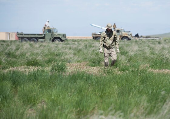 Explosive ordnance disposal members from the 366th Civil Engineer Squadron scan the range for explosives during a range clearance at Saylor Creek Range Complex, Idaho, May 9, 2016. The most common explosives found during the clearance were simulated surface-to-air missiles, called Smokey SAMs. (U.S. Air Force photo by Airman 1st Class Chester Mientkiewicz/Released)