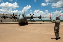 U.S. Air Force Senior Airman Christopher Edgington, 19th Aircraft Maintenance Squadron C-130J crew chief, marshals a new C-130J aircraft prior to a welcoming ceremony held at Little Rock Air Force Base, Ark., June 20, 2016. The aircraft was the final J-model delivered to the 19th Airlift Wing from Lockheed Martin. On Jan. 1, 2016, the 913th Airlift Group’s active association designation officially changed to a classic association. Airmen assigned to the 913th AG, Air Force Reserve Command, are currently providing support to the 41st Airlift Squadron and 61st Airlift Squadron and may soon be flying and providing maintenance support for this aircraft. (U.S. Air Force photo/Senior Airman Harry Brexel/Released)