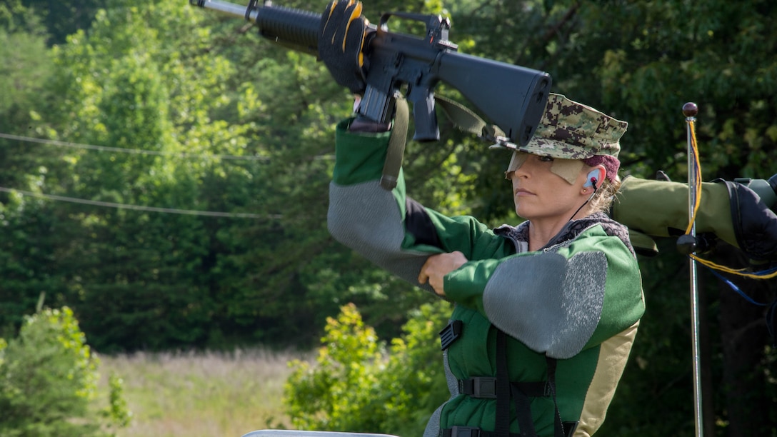 U.S. Navy Lt. j.g. Erica Olson prepares to shoot her first round at the 55th Interservice Rifle Championship at Range 4, Weapons Training Battalion, Marine Corps Base Quantico, Virginia, June 22, 2016. The interservice marksmanship competition was recognized and endorsed in 1960 and has participants from all branches of the military. 