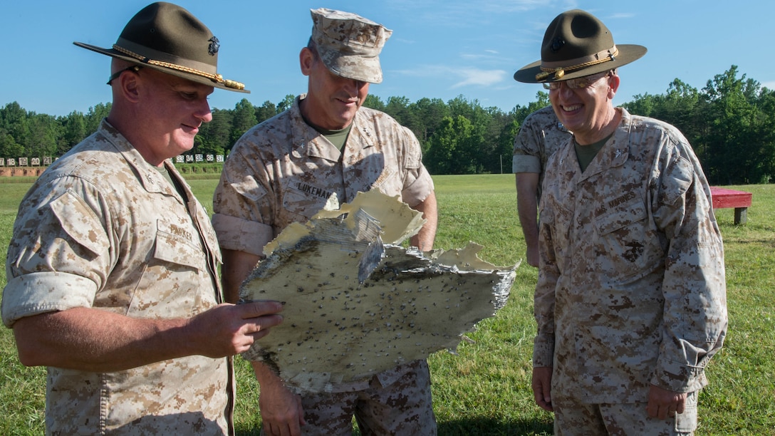 U.S Marine Corps Col. Timothy Parker, Maj. Gen. Robert Lukeman and Col. Gregory Kitchens look at the opening shot fired by Maj. Gen. Robert Lukeman during the opening ceremony for the 55th annual Interservice Rifle Championship at Range 4, Weapons Training Battalion, Marine Corps Base Quantico, Virginia, June 22, 2016. The competition was recognized and endorsed in 1960 and has participants from all branches of the military. 