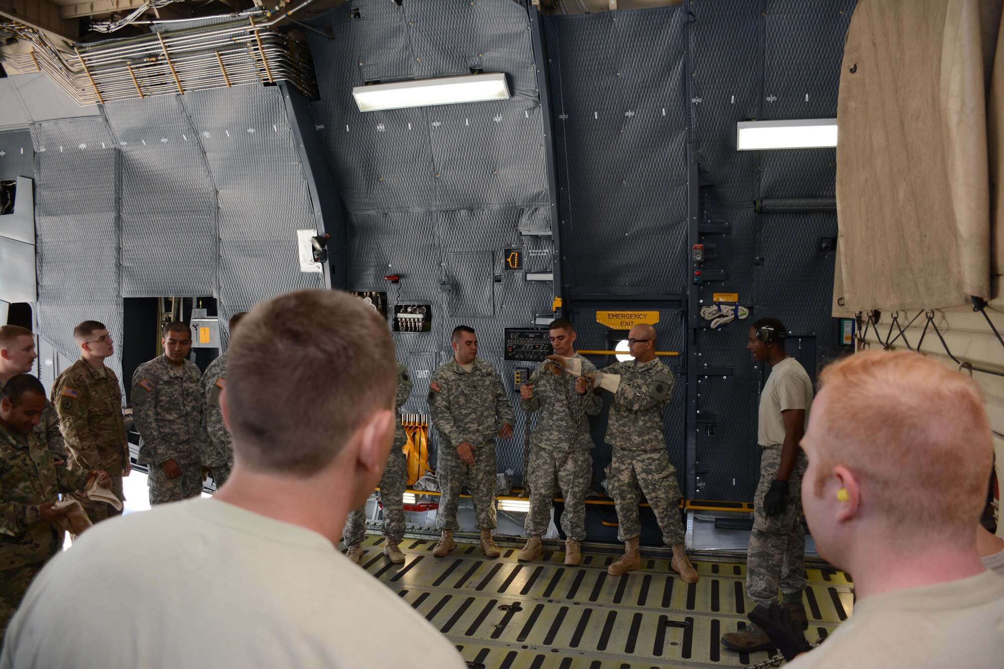 Soldiers from the 1397 Deployment and Distribution Support Battalion receive training from Air Force Reserve aerial porters June 18, 2016, on how to properly secure vehicles on the C-5 Galaxy.  (U.S. Air Force photos/Staff Sgt. Madelyn Brown)