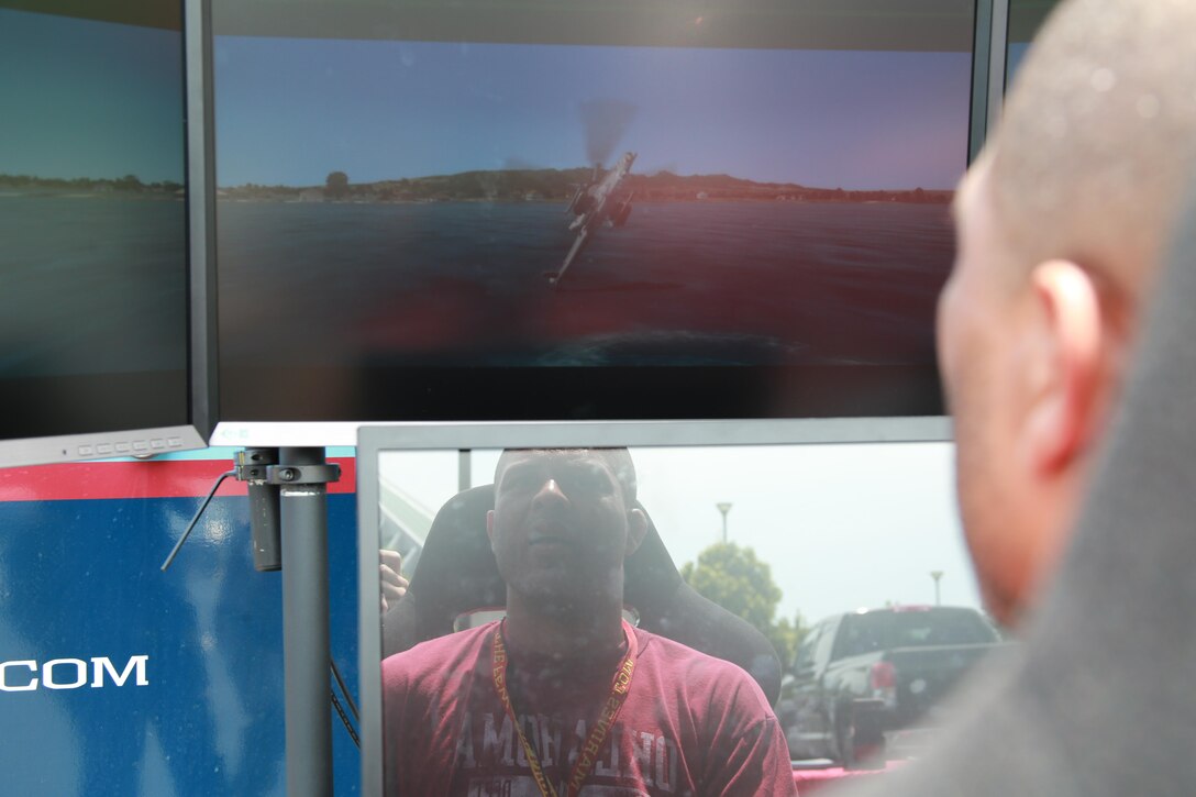 Kenard Booker takes off in a flight simulator at the National Museum of the Marine Corps as part of the 2016 Key Leaders and Educators Workshop in Triangle, Va., June 22. The workshop includes events such as infantry patrolling, flying in an MV-22 Osprey and more. The event also creates a mutually beneficial relationship between educators and the Marine Corps where key leaders and educators can share knowledge on the Corps based on firsthand experience to their students who show interest in officer programs. Brooker is a TRiO Pre-College Programs Director for North Dakota State University, Fargo, ND. 
