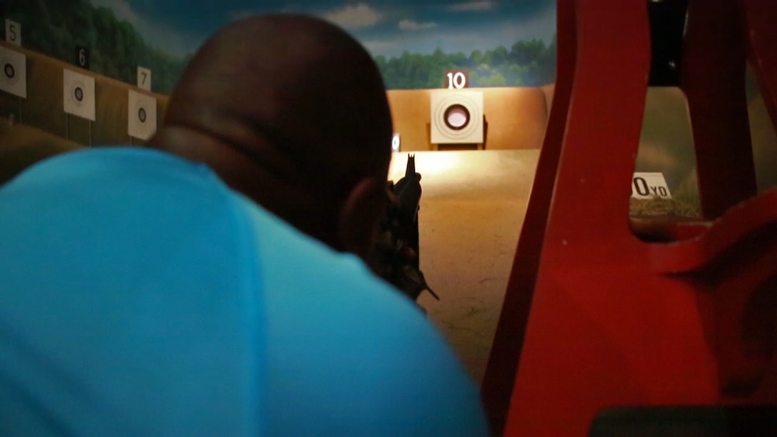Marc Malone shoots in a rifle-range simulator at the National Museum of the Marine Corps as part of the 2016 Key Leaders and Educators Workshop in Triangle, Va., June 22, 2016. The events during the workshop create a mutually beneficial relationship between educators and the Marine Corps where key leaders and educators can share knowledge on the Corps based on firsthand experience to their college students interested in becoming Marine officers. Malone is an academic advisor for Purdue University​, West Lafayette, Indiana. 
