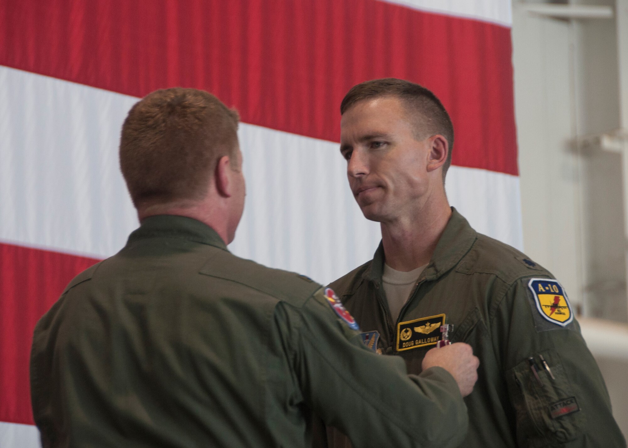 Lt. Col. John Galloway Jr., 358th Fighter Squadron outgoing commander, receives the Meritorious Service Medal during the change of command ceremony in the A-10 hangar at Whiteman Air Force Base, June 21, 2016. Galloway aided the 358 FS Airmen in providing a total force combat ready fighter squadron of A-10C aircraft and personnel. (U.S. Air Force photo by Senior Airman Missy Sterling/Released) 