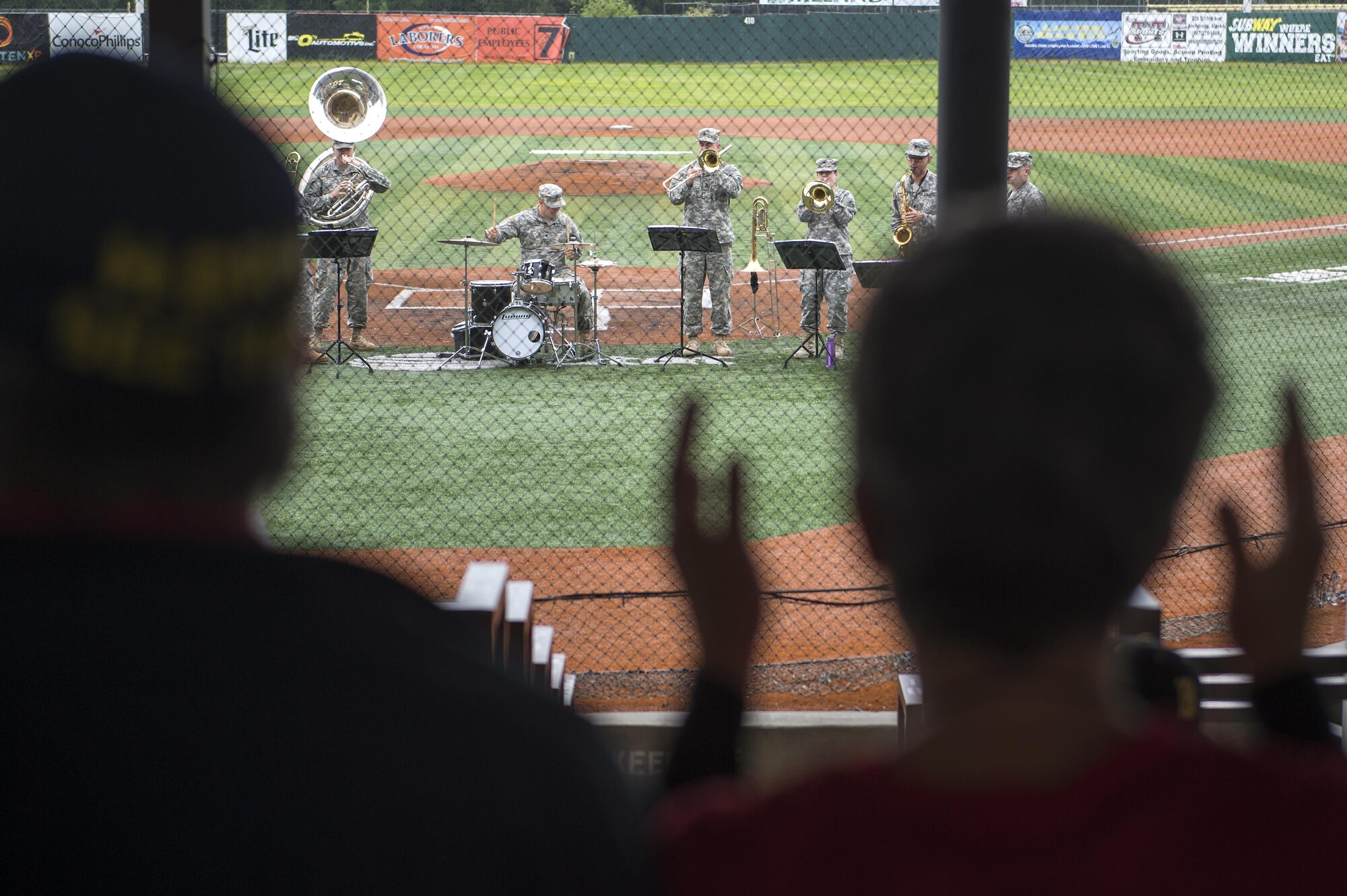Fans enjoy music from the 9th Army Band from Fort Wainwright during the Anchorage Bucs Military Appreciation Game at Mulchay Stadium in Anchorage, Alaska, June 19, 2016. (U.S. Air Force photo by Senior Airman James Richardson/Released)