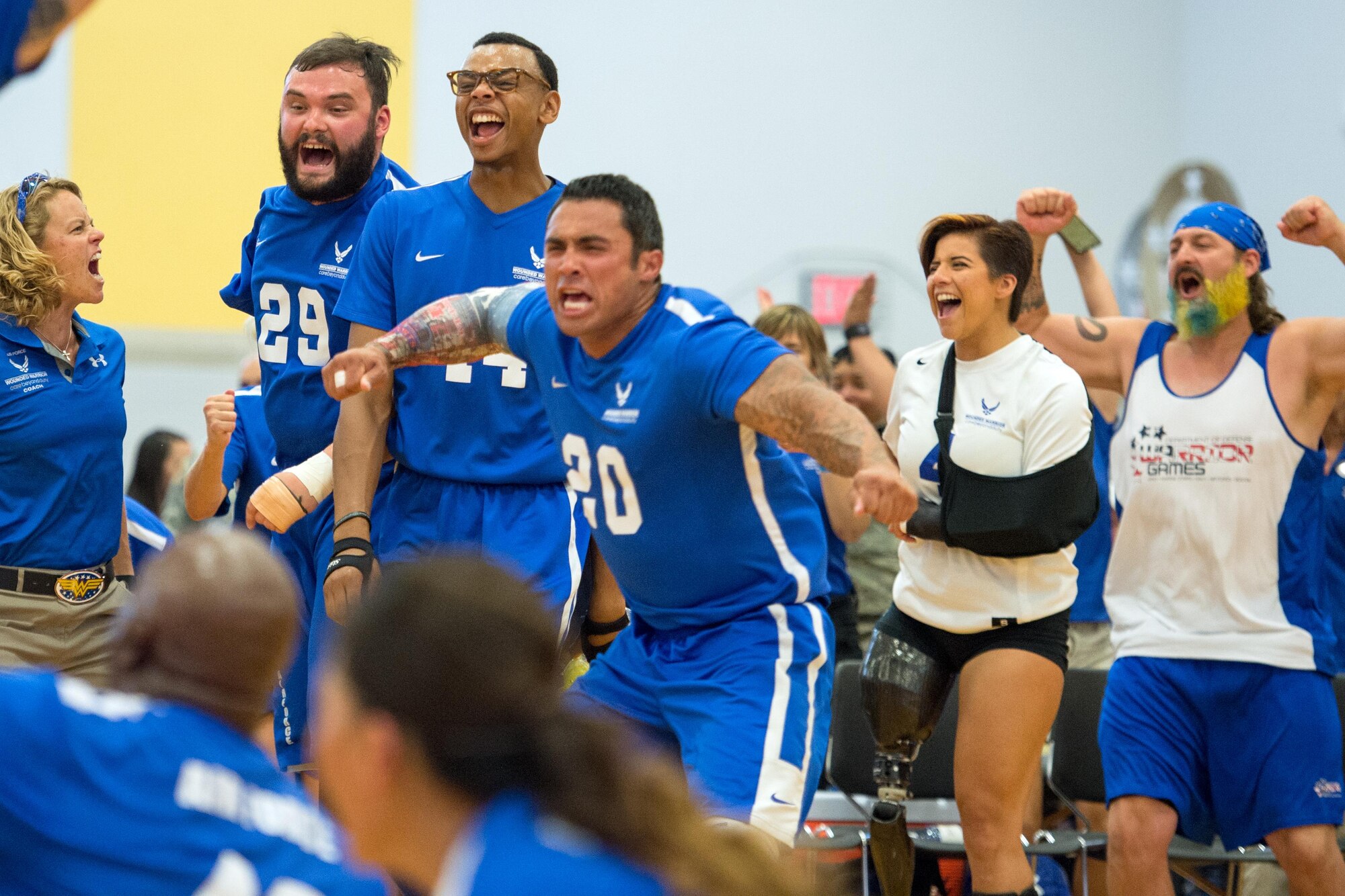 Air Force sitting volleyball team captain Tech. Sgt. Christopher Ferrell, center, and Air Force sitting volleyball team members react to winning gold in the 2016 Department of Defense Warrior Games at the U.S. Military Academy in West Point, N.Y., June 21, 2016. (DOD photo/EJ Hersom)