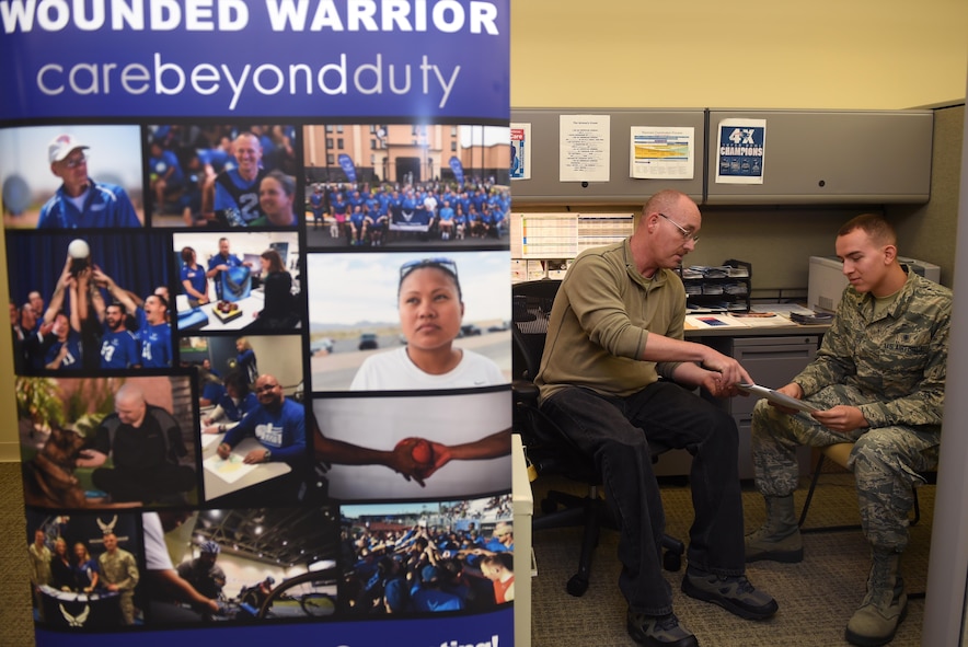 Robert Snyder, McChord Field Air Force Recovery Care Coordinator, speaks to an Airman inside the 62nd medical clinic June 20, 2016 at Joint Base Lewis-McChord, Wash. Snyder, a recent amputee has assisted more than 140 Wounded Warriors throughout the state of Washington and Oregon for the last three years. (Air Force Photo/Staff Sgt. Naomi Shipley)