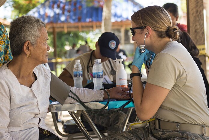 U.S. Air Force TSgt. Nicole Olive, Idaho Air National Guard’s 124th Fighter Wing medical technician, listens to the heartbeat of patient during Pacific Angel 16-2, June 13, 2016, in Kampot Province, Cambodia.  The Idaho National Guard has partnered with Cambodia’s Armed Forces to train together through the Air National Guard’s State Partnership Program. The program is designed to provide a consistent, enduring, and genuine presence, built over time through professional, personal, and institutional relationships that span continents and decades. 