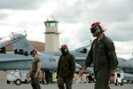 U.S. Marine Corps Sgt. Malcolm Cappelle, a quality assurance safety observer with Marine Fighter Attack Squadron (VMFA) 314, stationed at Marine Corps Air Station Miramar, California, and forward deployed to MCAS Iwakuni, Japan, walks with his team to an arriving F/A-18C Hornet during exercise Red Flag-Alaska 16-2 at Eielson Air Force Base, Alaska, June 16, 2016. Cappelle’s team carried and secured ordnance on the squadron’s fighter jets in support of exercise Red Flag-Alaska 16-2. 