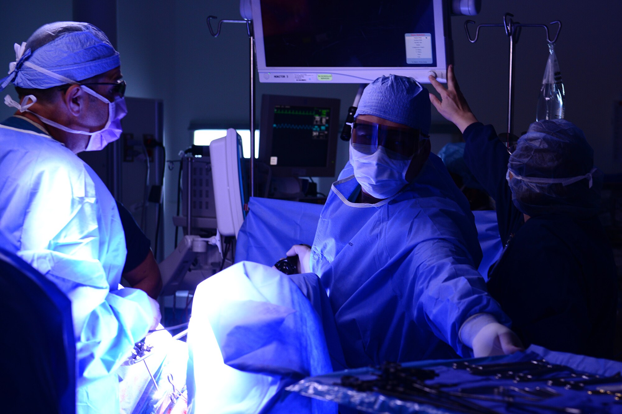 U.S. Air Force Airmen assigned to the 633rd Medical Operations Squadron perform a hysterectomy at Langley Air Force Base, Va., June 14, 2016. The surgery was performed laparoscopically, using a 3-D camera which gives surgeons greater depth than using a 2-D system. (U.S. Air Force photo by Staff Sgt. Ciara Gosier)
