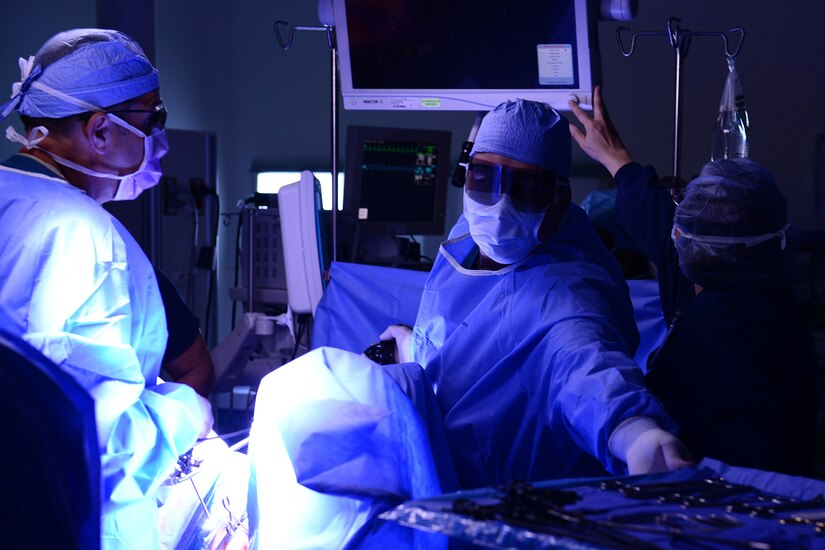 U.S. Air Force Airmen assigned to the 633rd Medical Operations Squadron perform a hysterectomy at Langley Air Force Base, Va., June 14, 2016. The surgery was performed laparoscopically, using a 3-D camera which gives surgeons greater depth than using a 2-D system. (U.S. Air Force photo by Staff Sgt. Ciara Gosier)