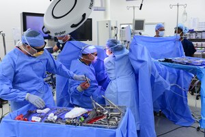 U.S. Air Force Airmen assigned to the 633rd Medical Operations Squadron finish a surgery at Langley Air Force Base, Va., June 14, 2016. The surgery was conducted using a new 3-D camera laparoscopically, which allows surgeons to increase accuracy and precision during procedures. (U.S. Air Force photo by Staff Sgt. Ciara Gosier)