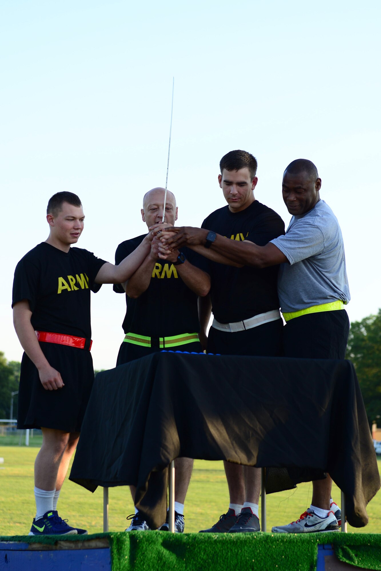 U.S. Army Maj. Gen. Anthony C. Funkhouser, center left, Center for Initial Military Training commander, cuts the Army birthday cake with junior and senior Soldiers at Fort Eustis, Va., June 14, 2016. Traditionally, the most senior and junior Soldiers cut the birthday cake together. (U.S. Air Force photo by Staff Sgt. J.D. Strong III)