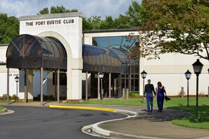 A couple walks to the Fort Eustis Club to attend the Army Ball at Fort Eustis, Va., June 17, 2016. U.S. Service members, civilian employees and their families attended the ball that celebrated the Army’s 241st birthday. (U.S. Air Force photo by Staff Sgt. Natasha Stannard)