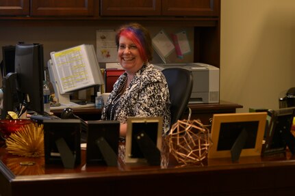 Nancy Current, 733rd Logistics Readiness Squadron unit program coordinator, laughs at a joke while visiting with a friend at Fort Eustis, Va., June 2, 2016. Current has worked in civil service for 29 years as a way to give back to Service members sacrificing for the nation’s freedom. (U.S. Air Force photo by Staff Sgt. Natasha Stannard) 