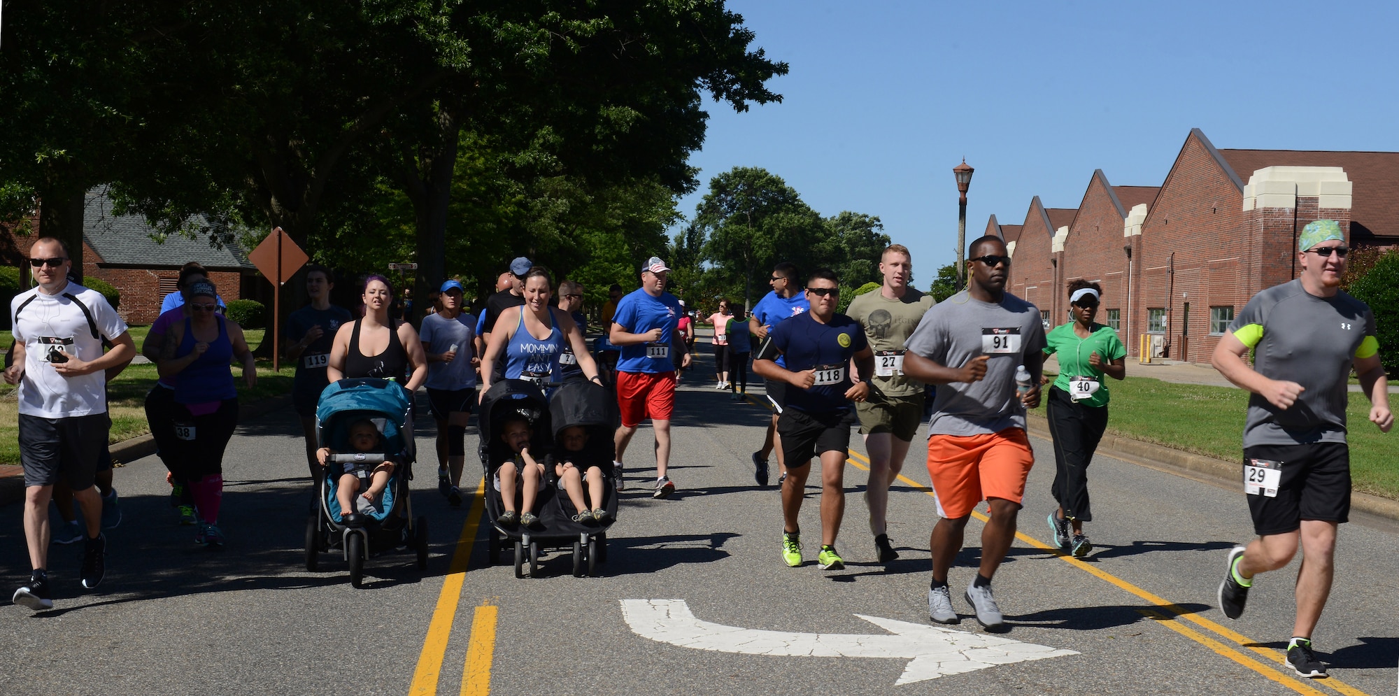 Participants begin the Langley Chapter Air Force Association Wounded Airman Program 5K at Langley Air Force Base, Va., June 18, 2016. The Wounded Airman Program is an AFA program geared toward providing prosthetics, financial aid, caregiver support and on-site support at adaptive sports camps. (U.S. Air Force photo by Staff Sgt. Teresa J. Cleveland)
