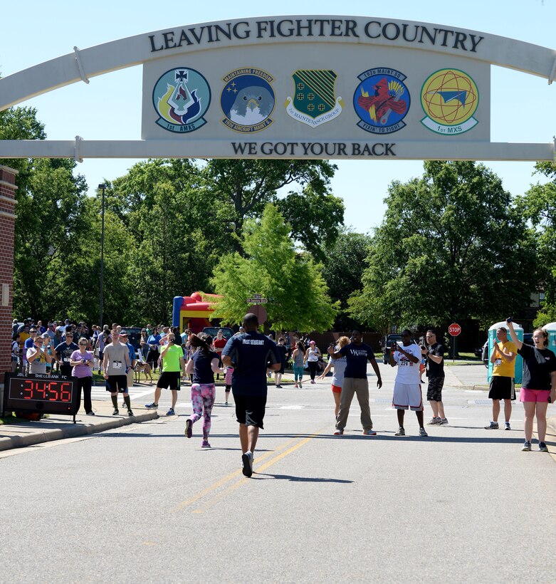 Runners in the Langley Chapter Air Force Association Wounded Airman Program 5K reach the finish line at Langley Air Force Base, Va., June 18, 2016. More than 250 people participated in the event. (U.S. Air Force photo by Staff Sgt. Teresa J. Cleveland)