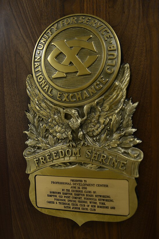 The National Exchange Club dedicated a Freedom Shrine during a ceremony at Langley Air Force Base, Virginia, June 14, 2016. Members of the 11 local exchange clubs volunteered their own time to assemble the documents on backgrounds and install all of the documents on the wall. (U.S. Air Force photo by Staff Sgt. Teresa J. Cleveland)