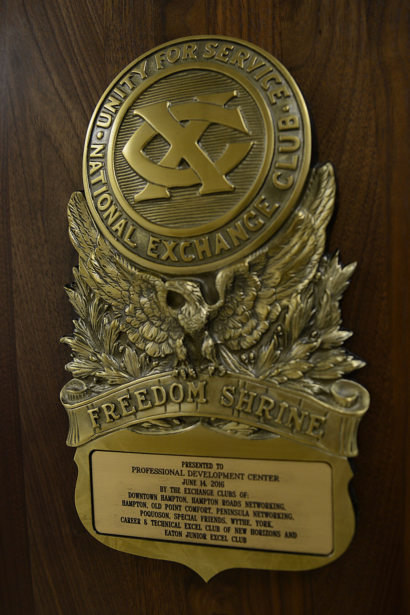 The National Exchange Club dedicated a Freedom Shrine during a ceremony at Langley Air Force Base, Virginia, June 14, 2016. Members of the 11 local exchange clubs volunteered their own time to assemble the documents on backgrounds and install all of the documents on the wall. (U.S. Air Force photo by Staff Sgt. Teresa J. Cleveland)