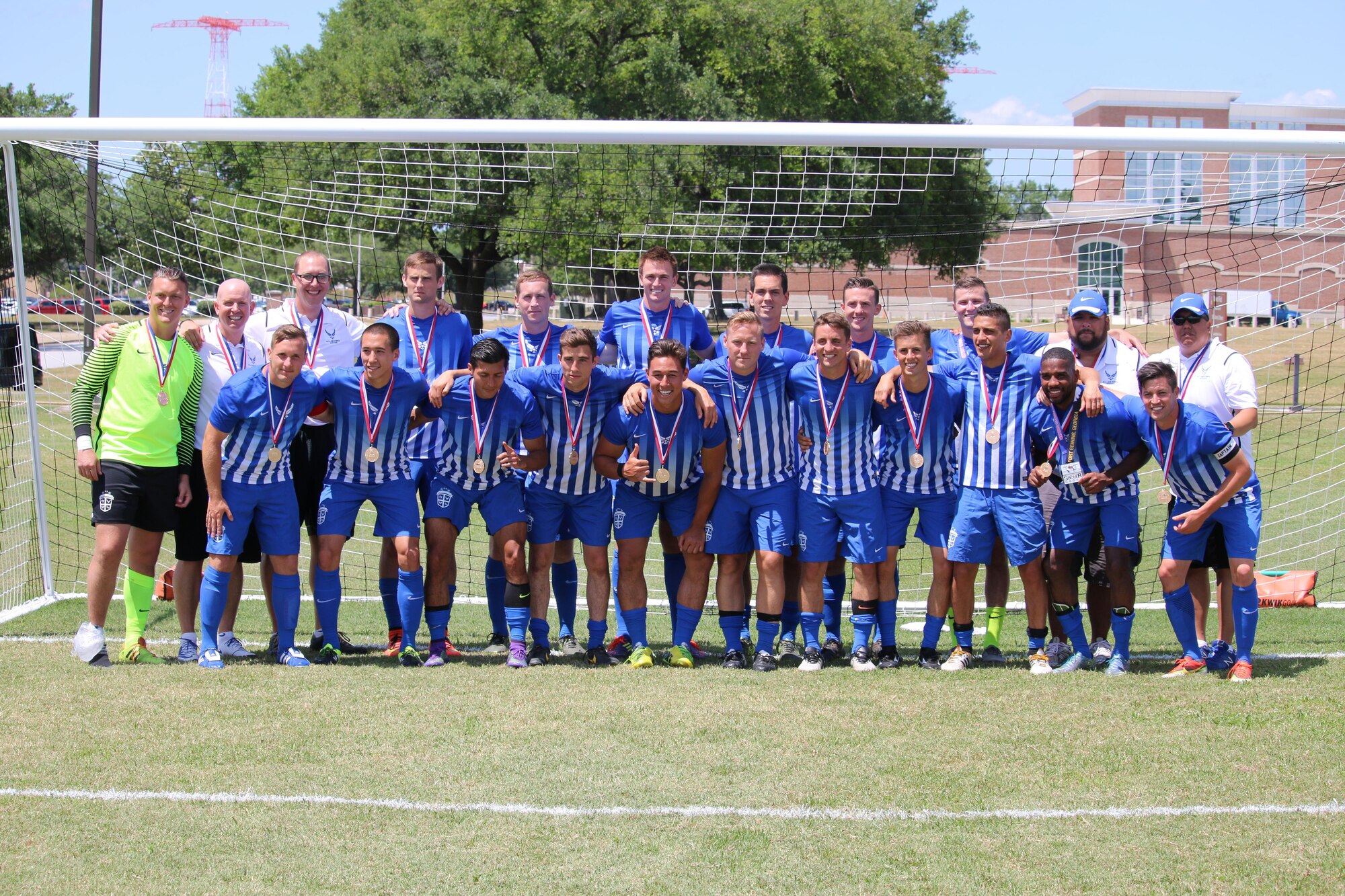 Members of the Air Force soccer team with their gold medals after winning the 2016 Armed Forces Men’s Soccer Championship at Fort Benning, Ga., May 13, 2016. Air Force prevailed in their rematch against Navy 3-2 on May 13 to capture the gold after a weeklong tournament at Fort Benning. (Courtesy photo/Steven Dinote)
