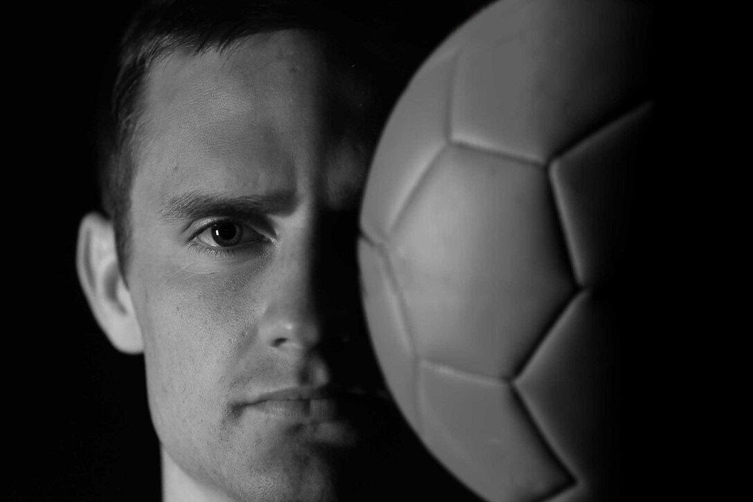 2nd Lt. Scott McGillivray, 341st Comptroller Squadron financial services officer, poses with a soccer ball June 21, 2016, at Malmstrom Air Force Base, Mont. McGillivray tried out and made the Men’s Air Force Soccer Team, and helped his team win the 2016 Armed Forces Championship tournament at Ft. Benning, Ga., in May. (U.S. Air Force illustration Senior Airman Jaeda Tookes)

