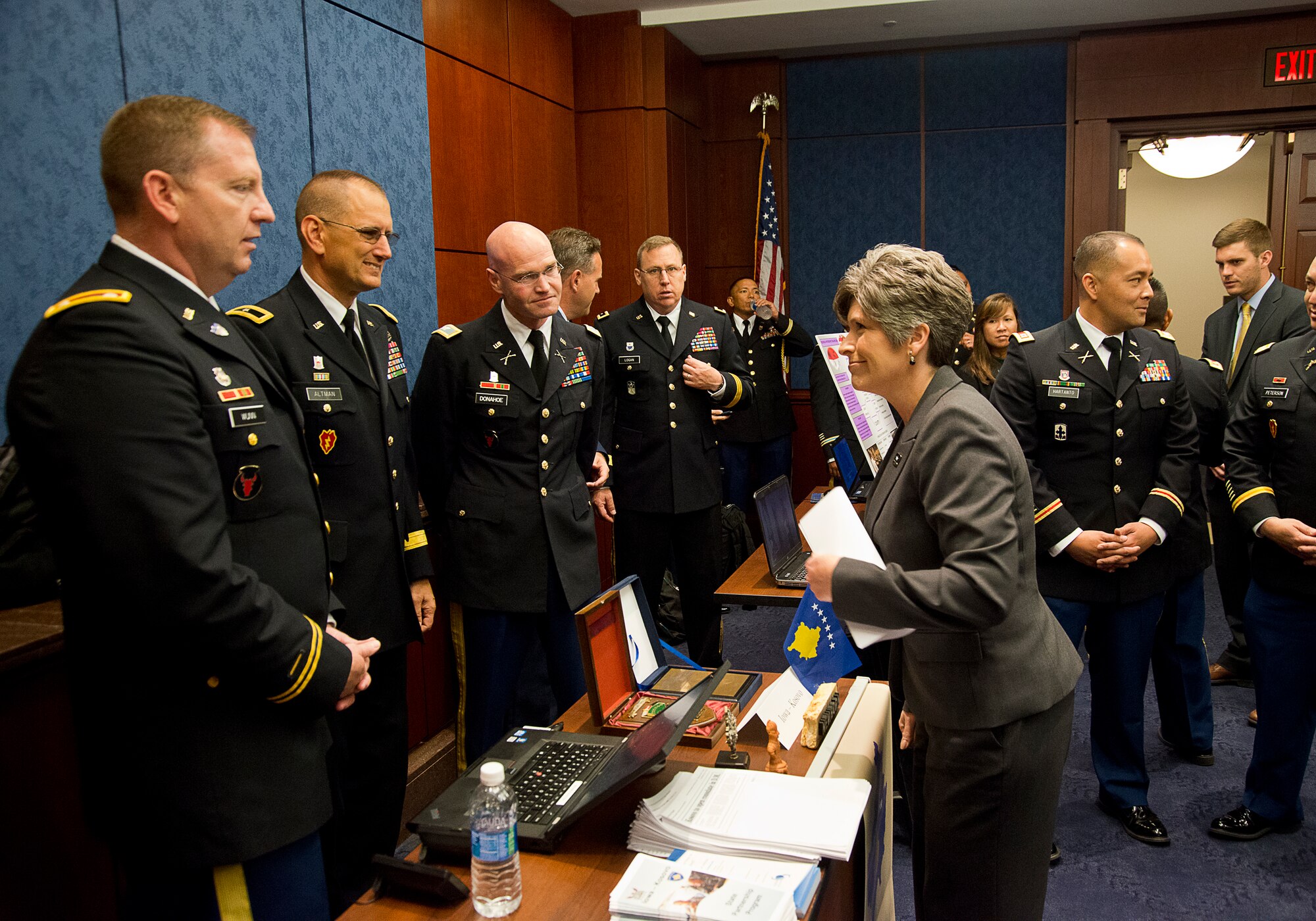 The Hon. Joni Ernst, U.S. Senator from Iowa, speaks with Soldiers and Airmen of the Iowa National Guard at the National Guard Bureau's State Partnership Program informational event held at the U.S. Capitol, June 16, 2016. Delegations from 19 different states and territories were Washington D.C. to build awareness and understanding of the SPP among Congress and Congressional staff members. (U.S. Air National Guard photo by Staff Sgt. John E. Hillier/released)