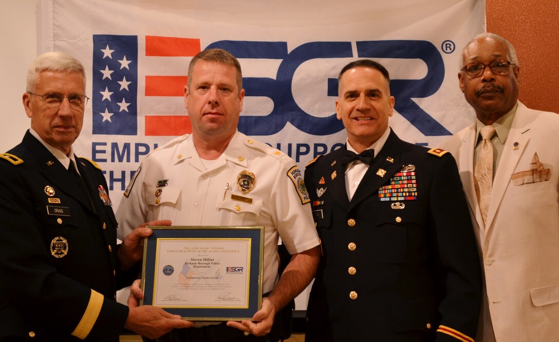 Steven Hillias, of the Perkasie Borough Police Department, receives an Employer Support of the Guard and Reserve Patriot Award from formerly The Adjutant General—Pennsylvania retired Maj. Gen. Wesley Craig, Jr., and Southeast Area Chairman for the Pennsylvania Employer Support of the Guard and Reserve Albert Newman, while standing with his nominator, Army Maj. Anthony DeLia, of the Pa. National Guard, during an ESGR recognition and awards banquet held in Horsham, Pa., June 14, 2016. The ESGR Patriot Award is presented to nominated employers who display exemplary support for their military employees. (U.S. Air National Guard photo by Tech. Sgt. Andria Allmond)
