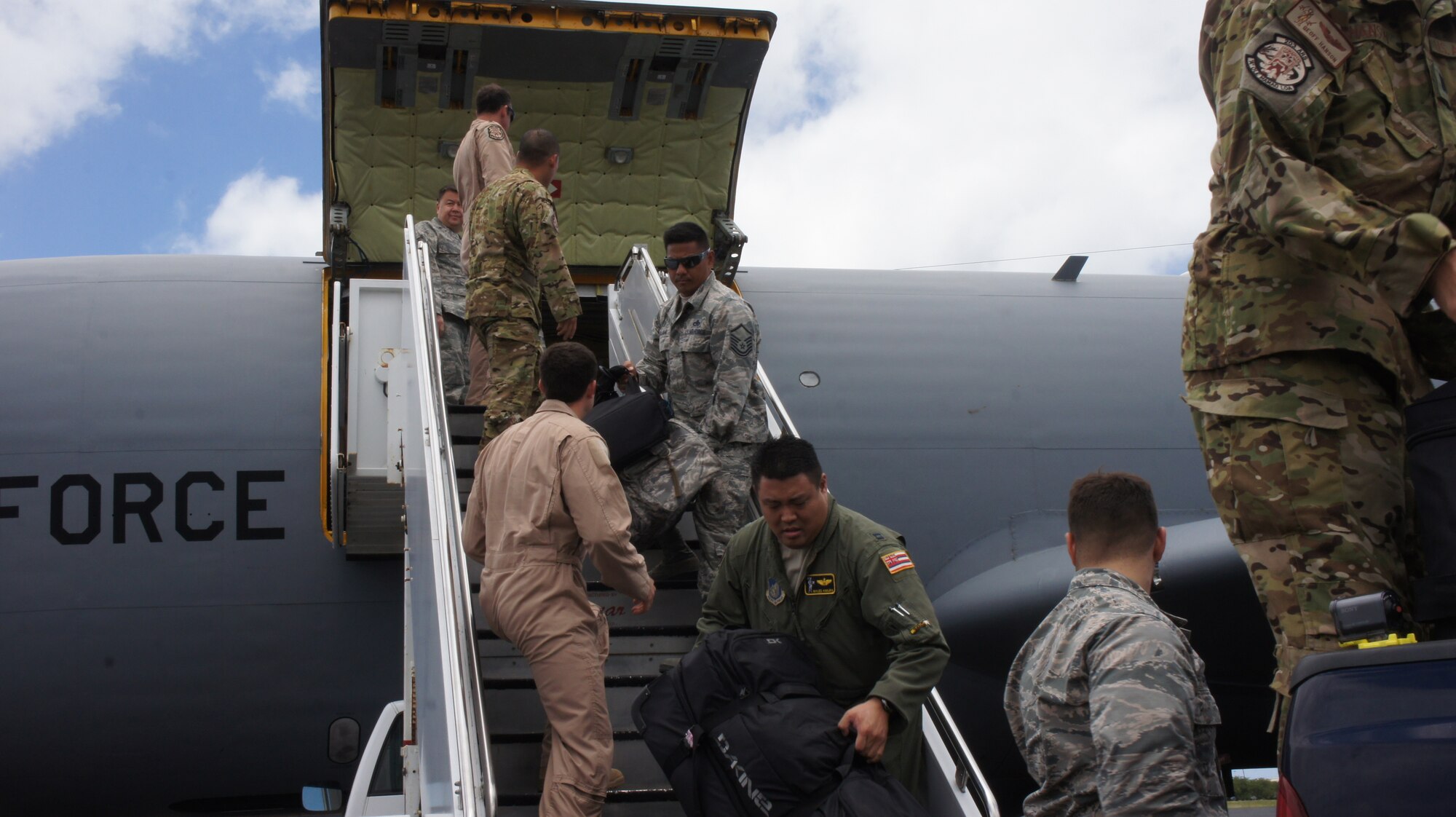 Airmen from the Hawaii Air National Guard's 203rd Air Refueling Squadron offload cargo from a KC-135 Stratotanker, Jun. 20, 2016, Joint Base Pearl Harbor-Hickam. More than 50 members of the Hawaii Air National Guard and three KC-135 aircraft returned home following a four month deployment in support of Operation Inherent Resolve.  The flight crews and aircraft from the 203rd ARS along with maintenance and other support personnel from the 154th Wing were part of the 18-Nation air Coalition in the fight against Daesh or ISIS.  (U.S. Air National Guard photo by Tech. Sgt. Andrew Jackson/released)