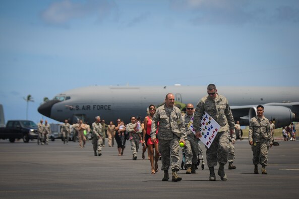 Airmen from the Hawaii Air National Guard's 203rd Air Refueling Squadron return home to Joint Base Pearl Harbor-Hickam, Hawaii, Jun. 16, 2016. More than 50 service members, three KC-135 Stratotankers, flight and maintenance crews, and other support personnel were deployed for four months as part of an Air Expeditionary Force rotation. (U.S. Air National Guard photo by Airman 1st Class Robert Cabuco/released) 