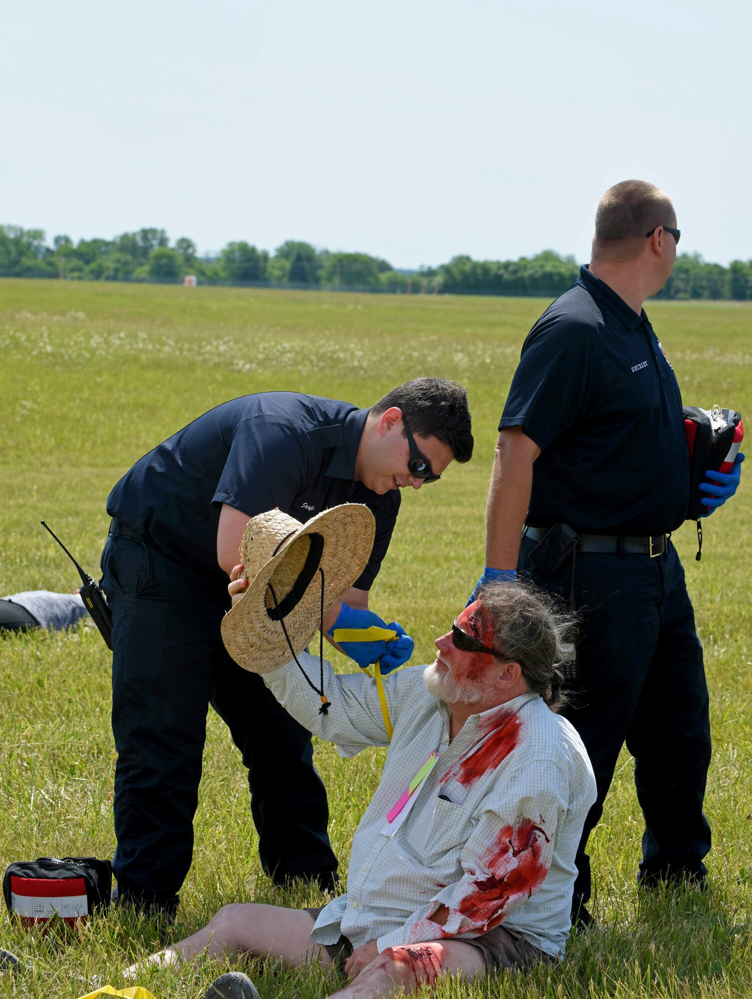 Local first responders tag an injured passenger according to medical assessment during a full-scale, mass casualty emergency preparedness exercise June 14, 2016 at Rickenbacker International Airport. The exercise was held to test and evaluate emergency response plans of the Columbus Regional Airport Authority, first response emergency services, hospitals, community non-profits and other local emergency preparedness organizations in the event of a major disaster. (U.S. Air National Guard photo by Airman 1st Class Ashley Williams/Released)