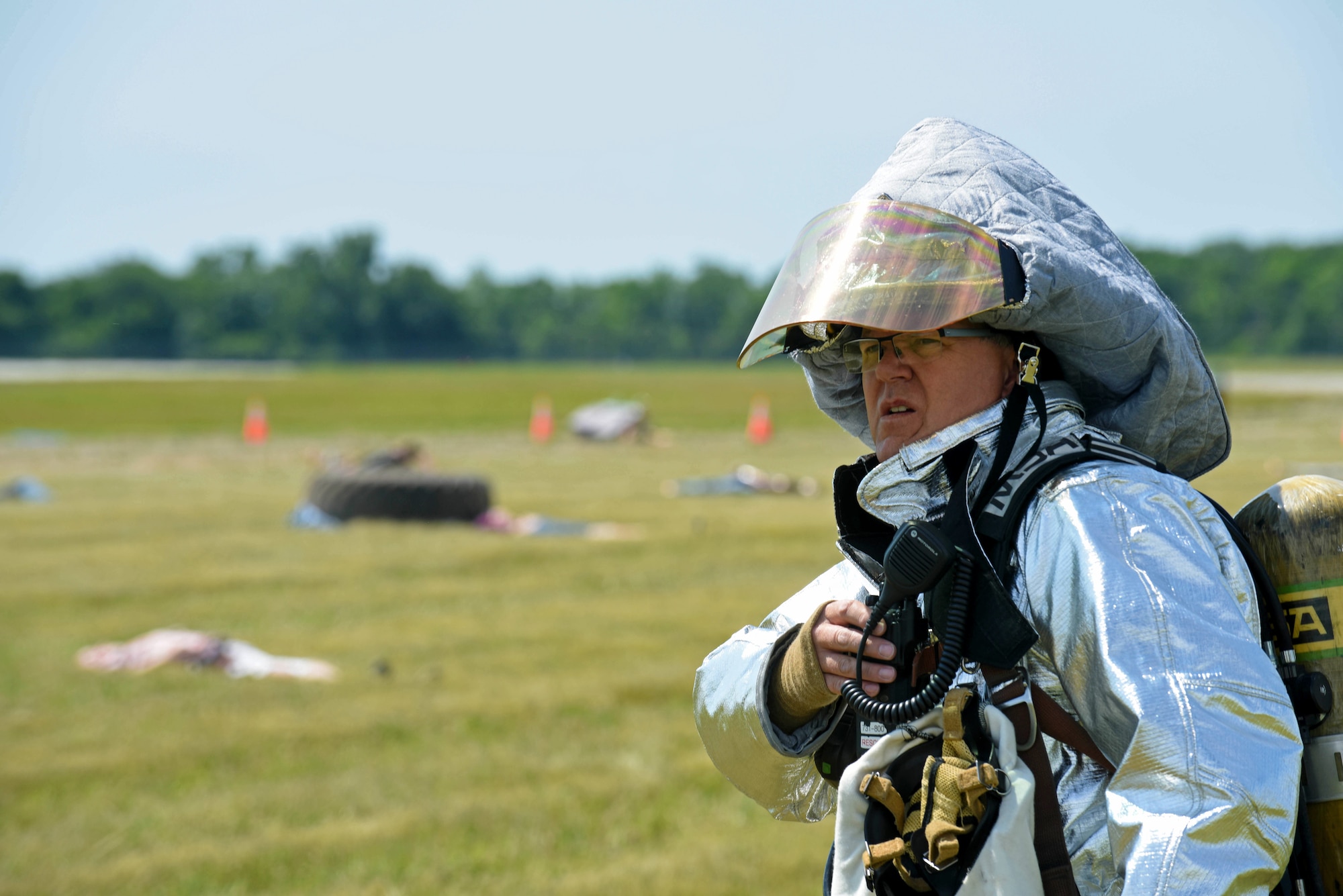 Fire Lt. Lewis Garver, with the 121st Civil Engineering Fire Department, begins the initial response to a full-scale, mass casualty emergency preparedness exercise June 14, 2016 at Rickenbacker International Airport. The exercise was held to test and evaluate emergency response plans of the Columbus Regional Airport Authority, first response emergency services, hospitals, community non-profits and other local emergency preparedness organizations in the event of a major disaster. (U.S. Air National Guard photo by Airman 1st Class Ashley Williams/Released)