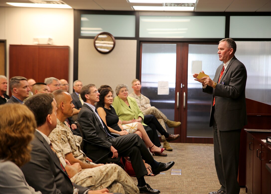 William “Bill” Taylor, Program Executive Officer Land Systems and a member of the Senior Executive Service, speaks to the audience during a Change of Leadership ceremony June 21 aboard Marine Corps Base Quantico, Virginia. Taylor—who has served as the Marine Corps’ only PEO since 2007—relinquished his duties after being selected as the next assistant deputy commandant for Sustainment for Marine Corps Aviation. (U.S. Marine Corps photo by Monique Randolph)